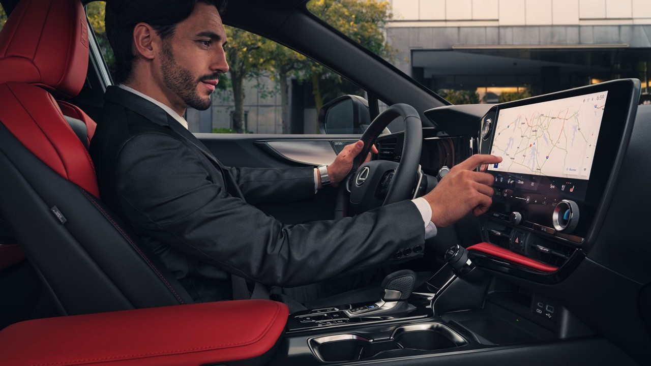 A man sat in a Lexus NX