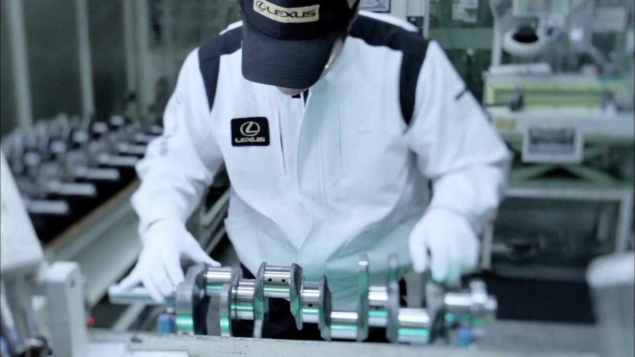 Lexus engineer working on an engine 